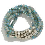 A set of sea blue beaded bracelets with square silver accents, displayed on a white background.