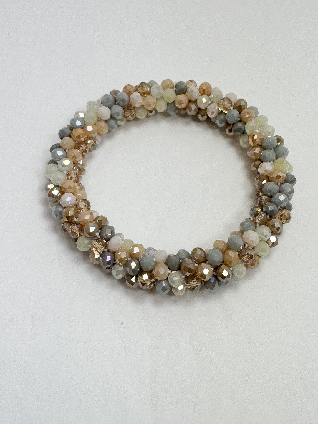 Beaded bracelet with multicolor stones on a white background