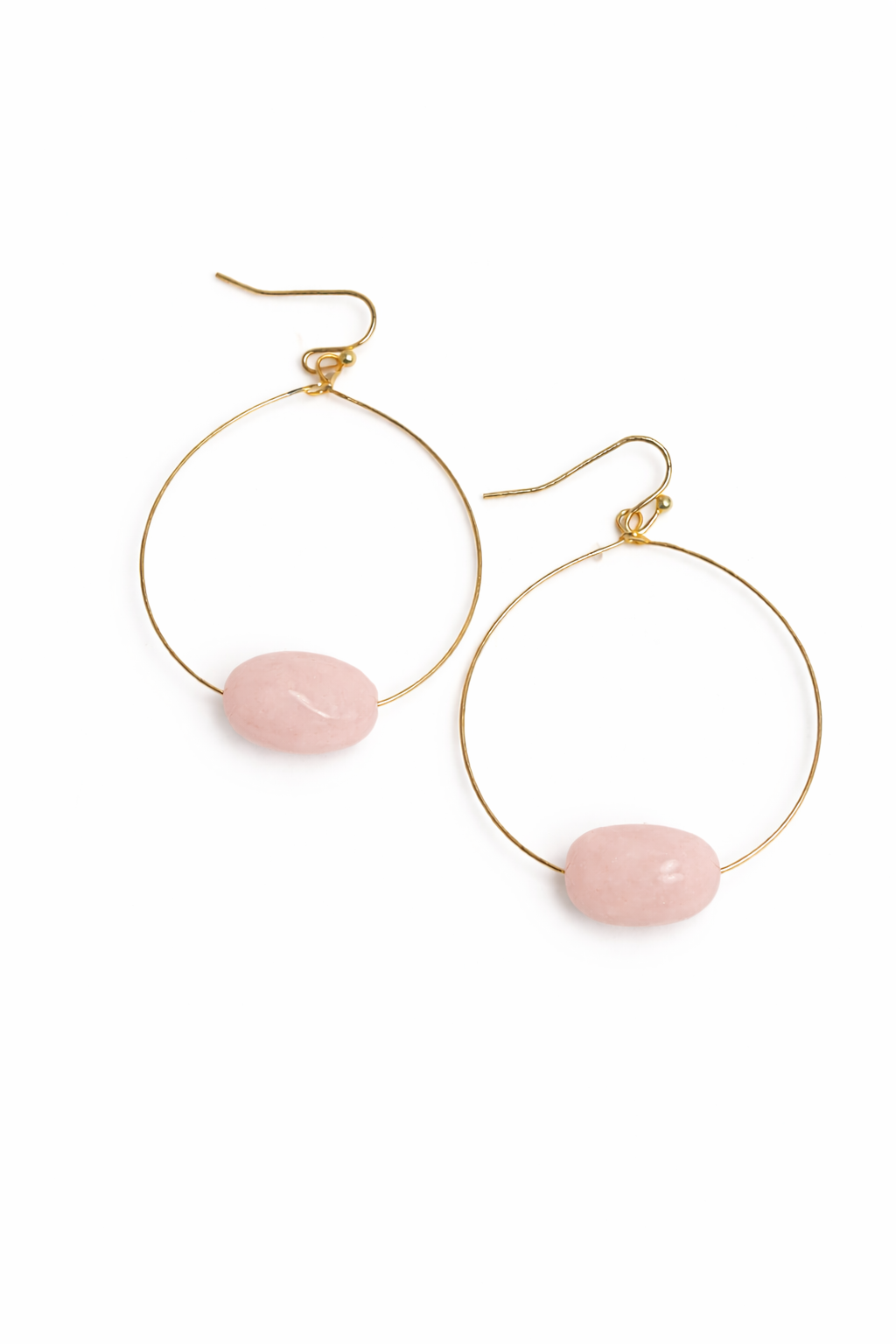 Gold hoop earrings with pink stones on a white background