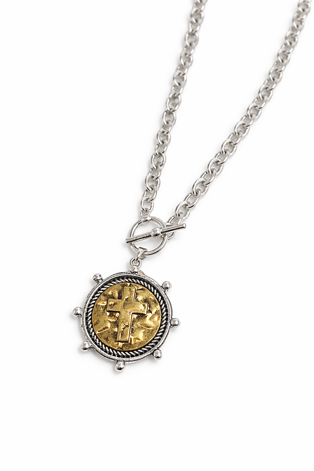 Necklace with a round pendant featuring gold and silver design on a white background