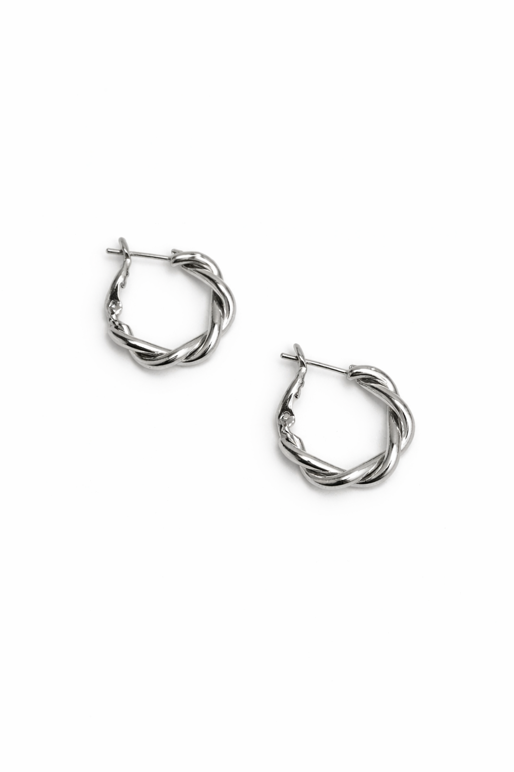 Pair of silver hoop earrings on a white background