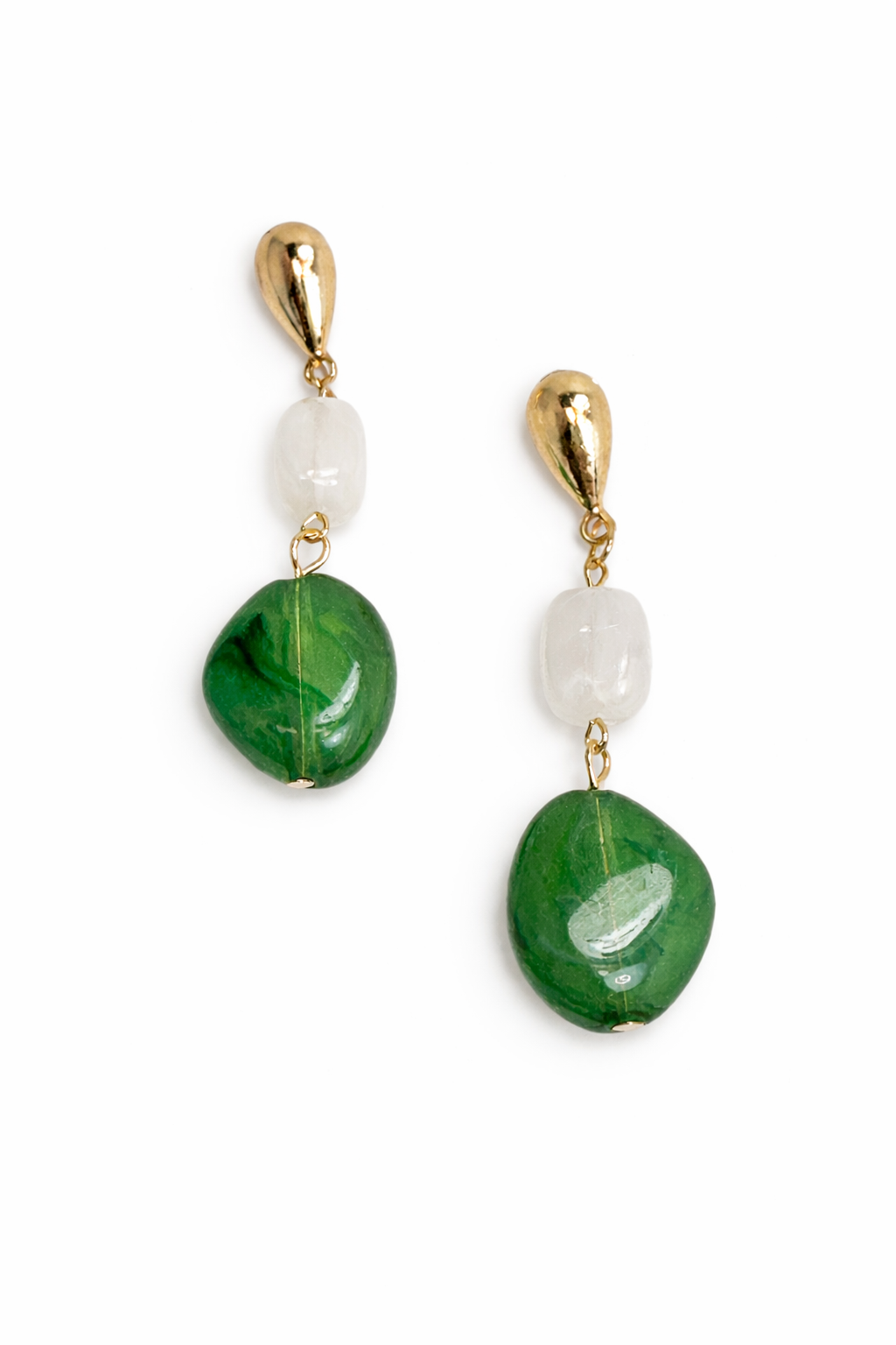 Pair of earrings with green and white beads on a white background