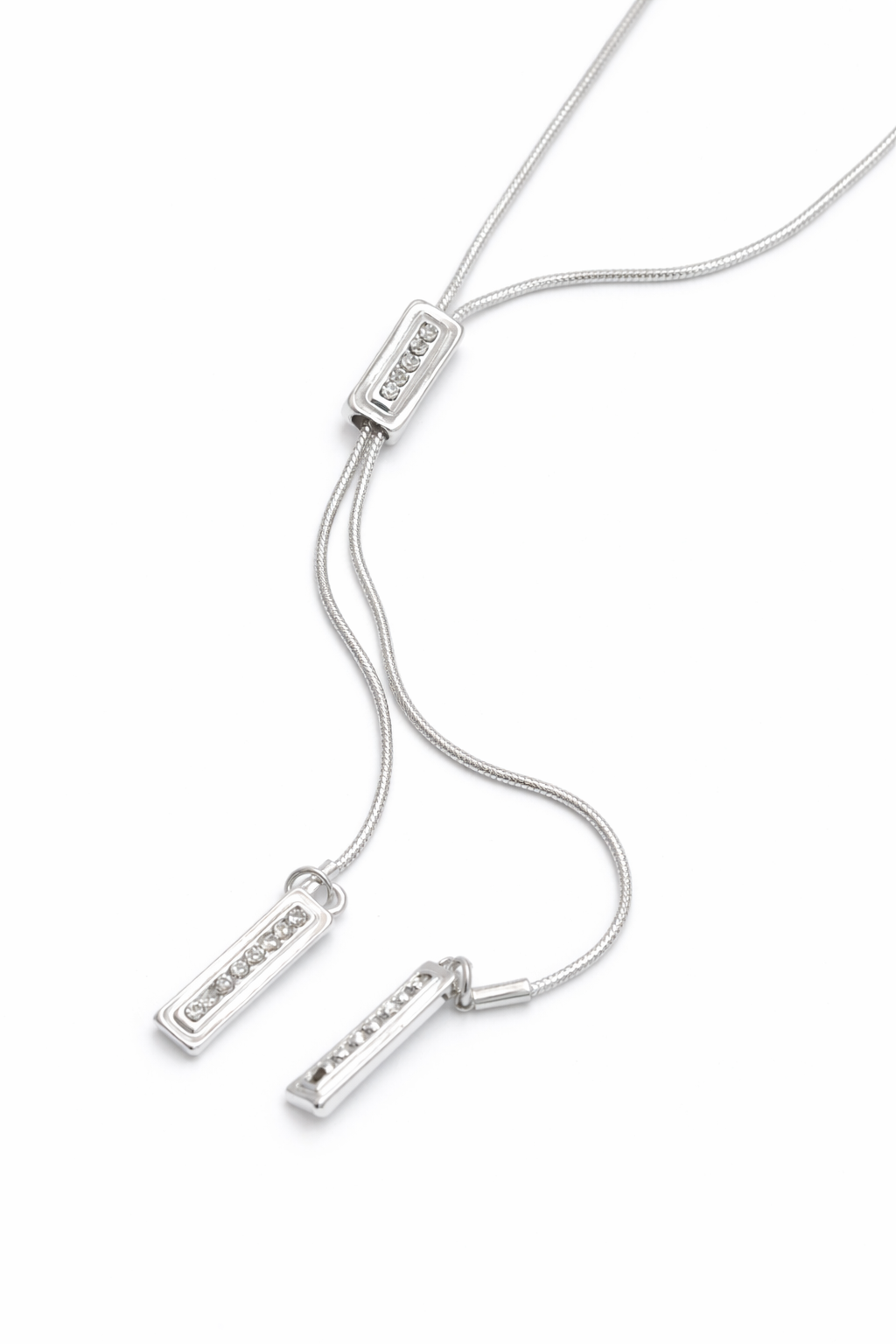 silver necklace with crystal details on white background