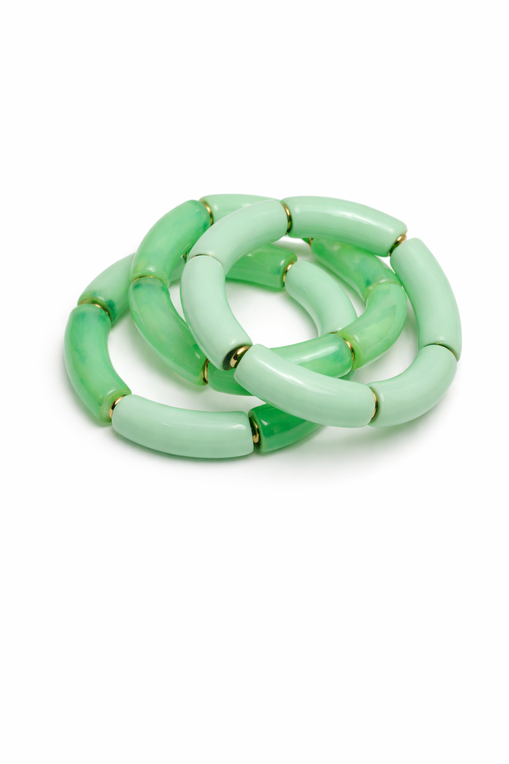 Green bracelet with gold accents on a white background