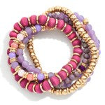 pink and purple beaded bracelet set with gold accents