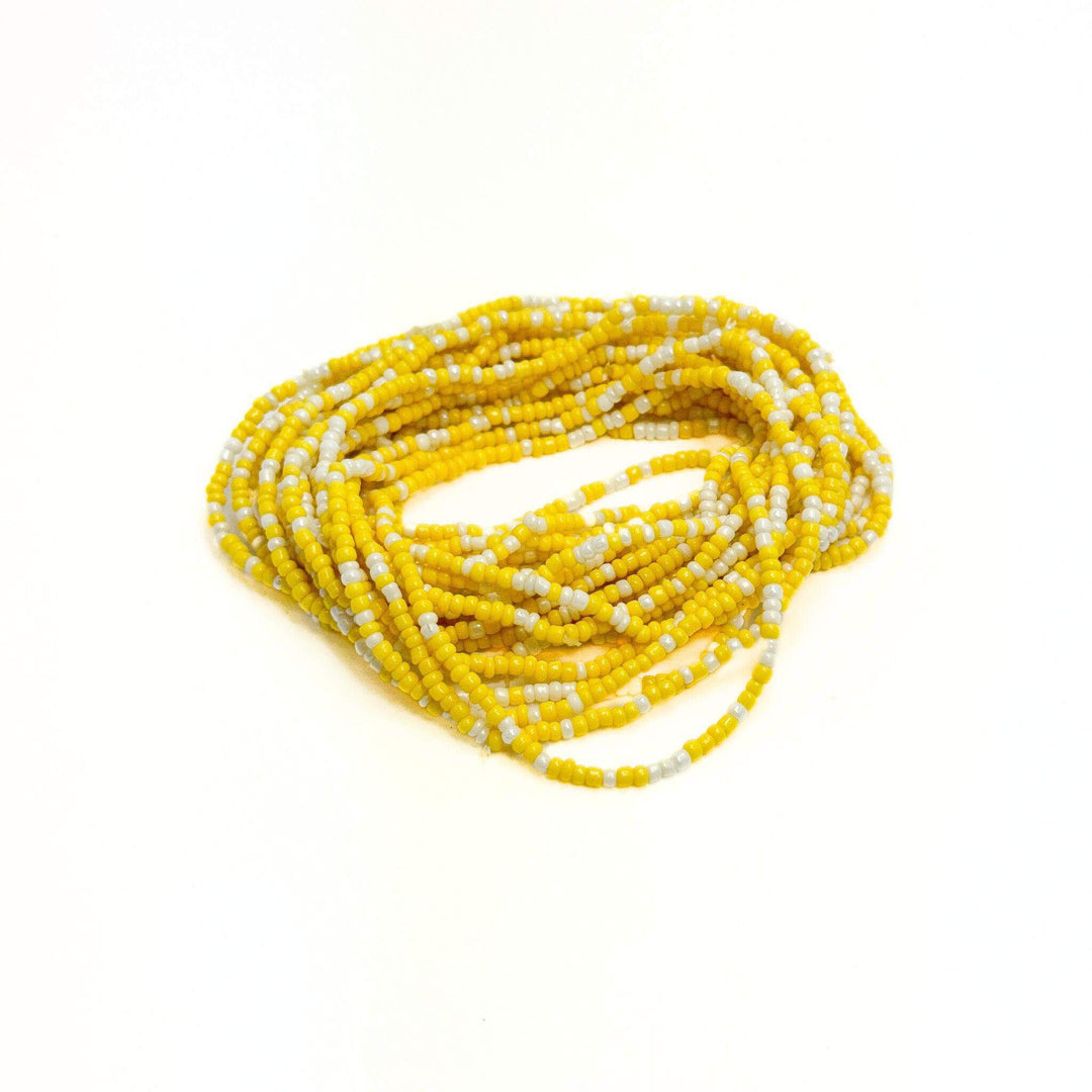 A bracelet set featuring a combination of yellow and white seed beads.
