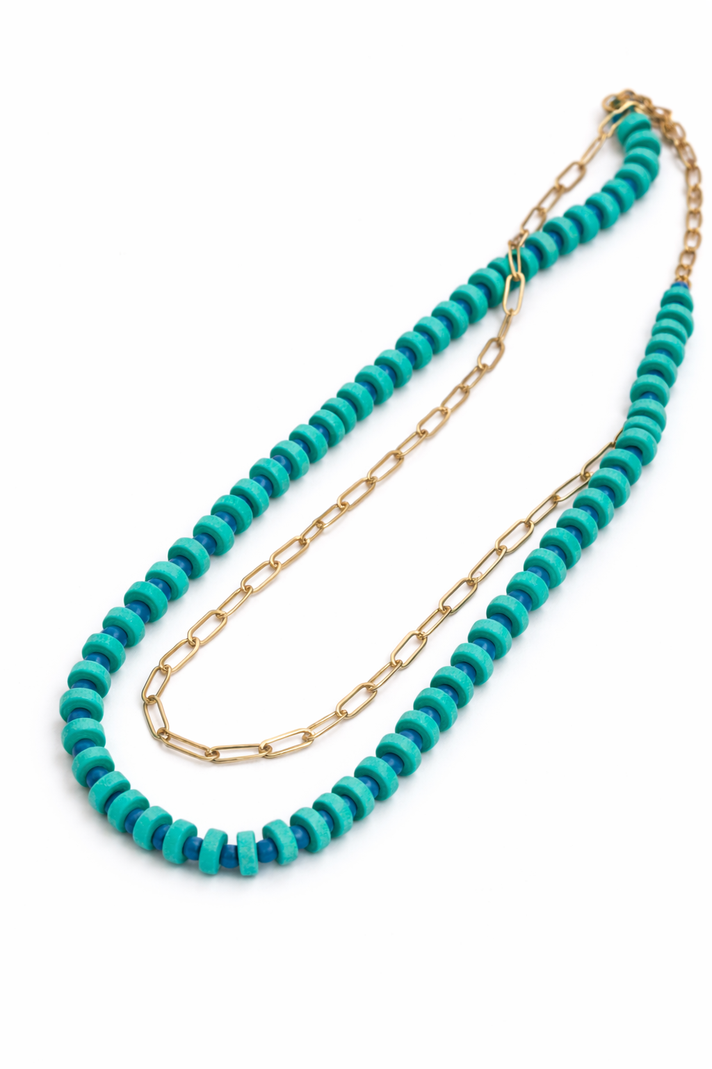Turquoise beaded necklace with gold chain on a white background