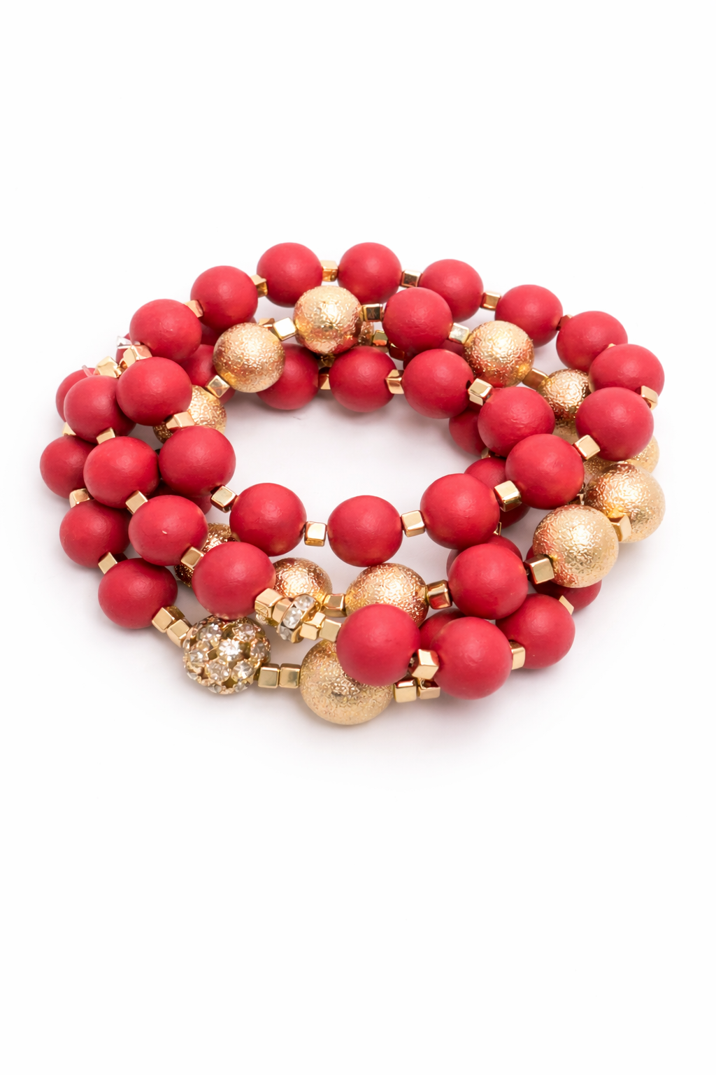 Stack of red and gold beaded bracelets on a white background