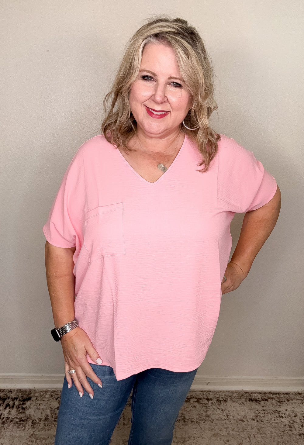 woman wearing candy pink vneck top