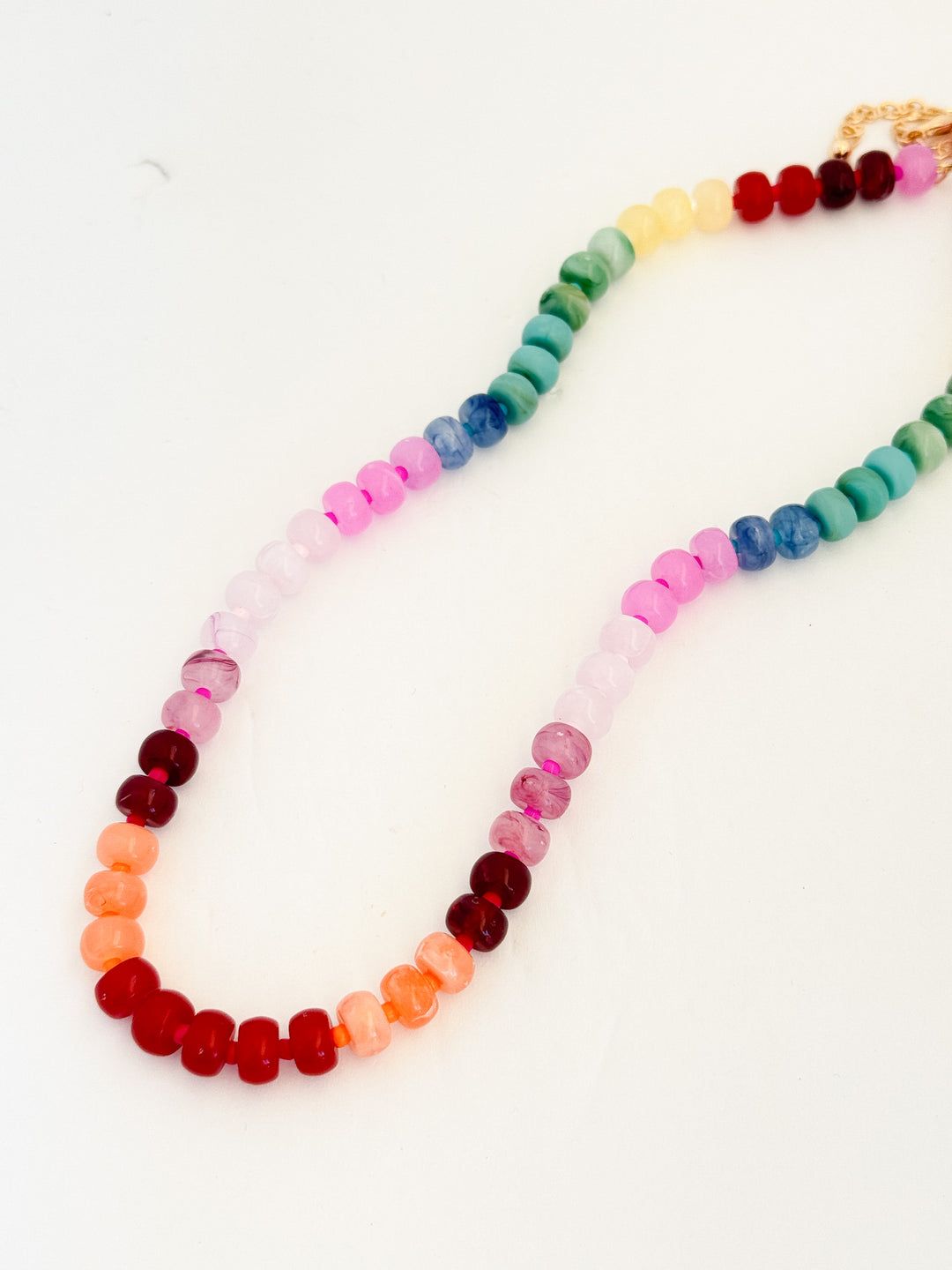 Colorful beaded necklace on a white background