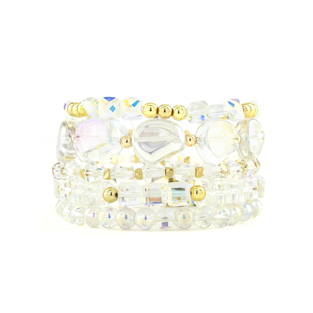 Set of beaded bracelets with gold accents on a white background