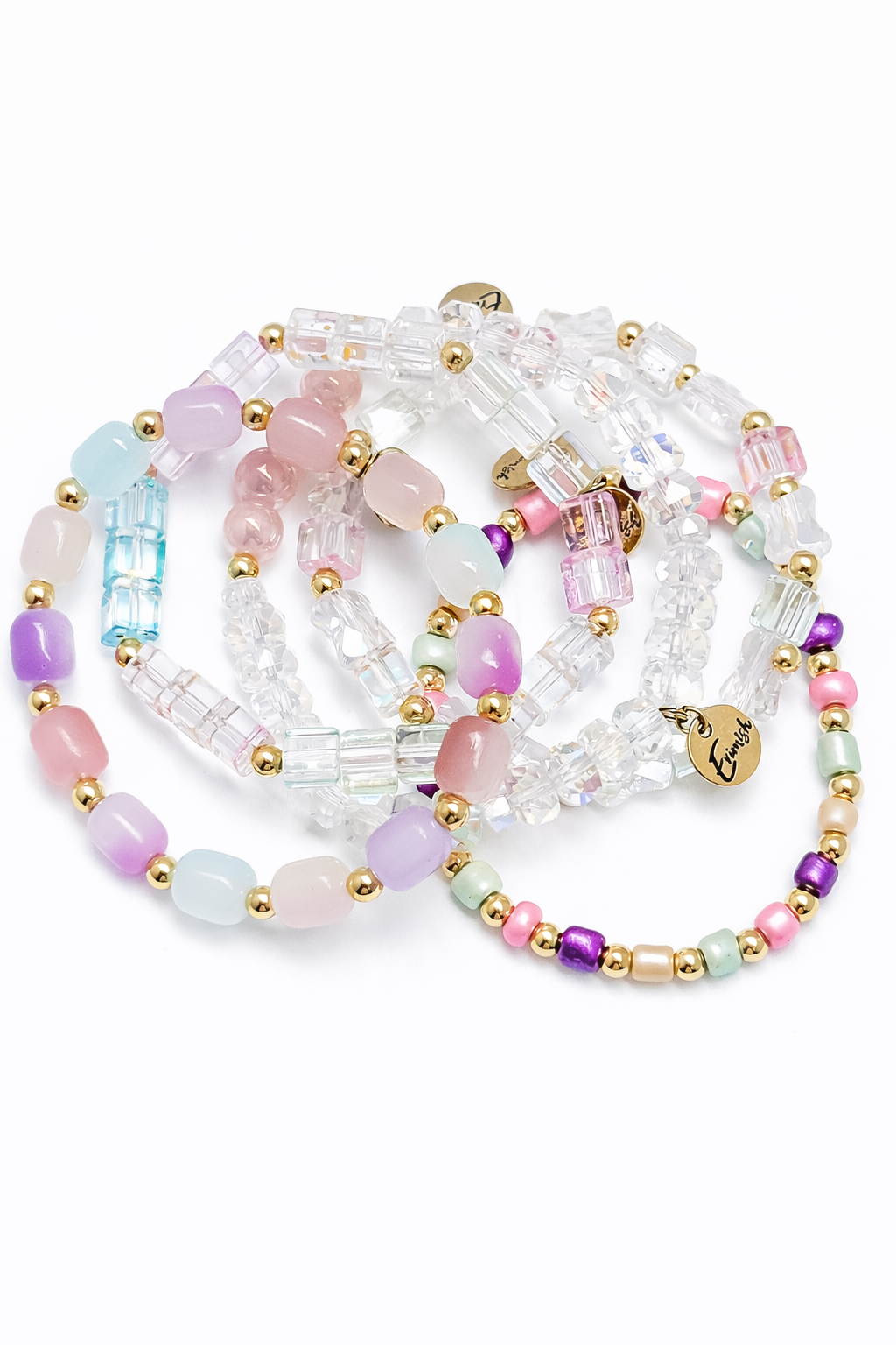 Set of colorful beaded bracelets on a white background
