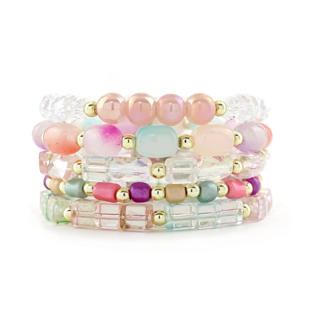 Set of colorful beaded bracelets on a white background