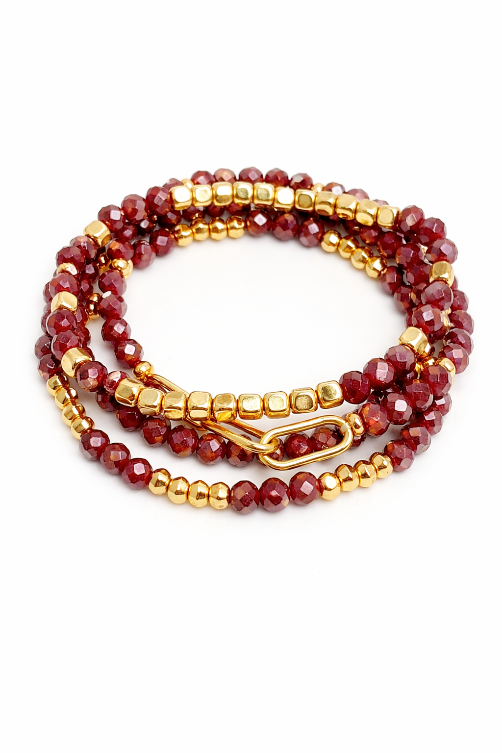 Set of red and gold beaded bracelets on a white background