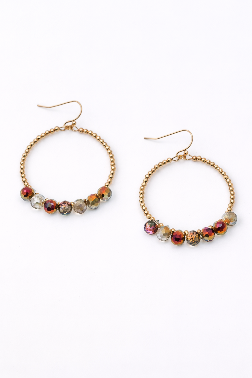 Gold hoop earrings with colorful beads on a white background