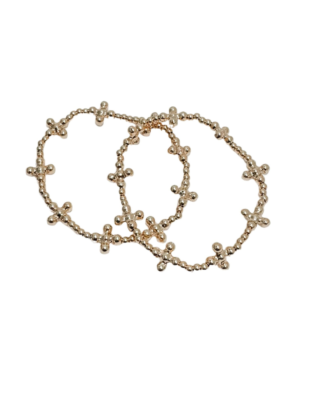 two gold beaded bracelets with cross details