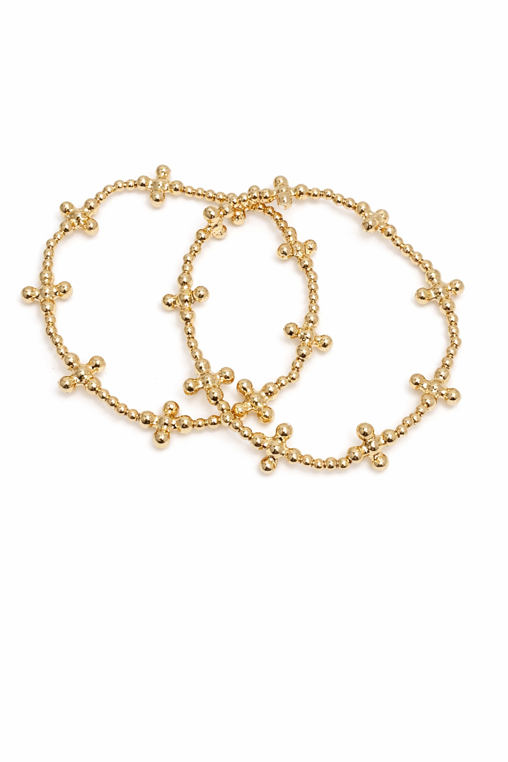 Gold bracelet with cross designs on a white background