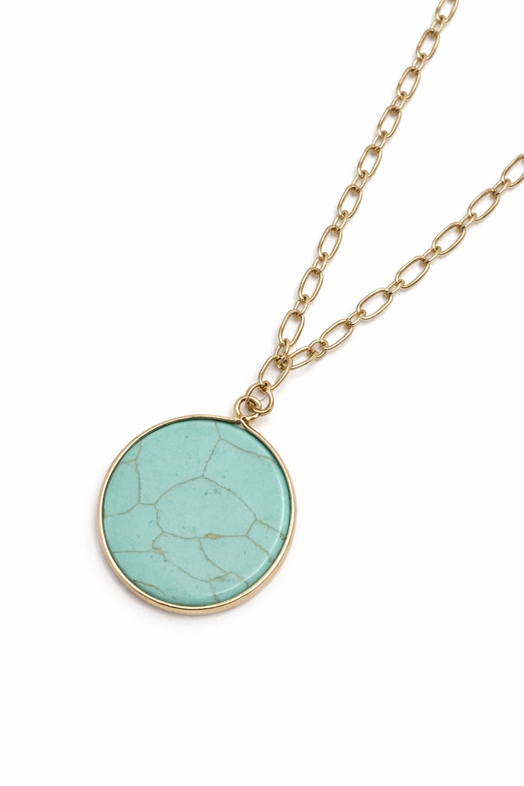 Necklace with a turquoise pendant on a white background