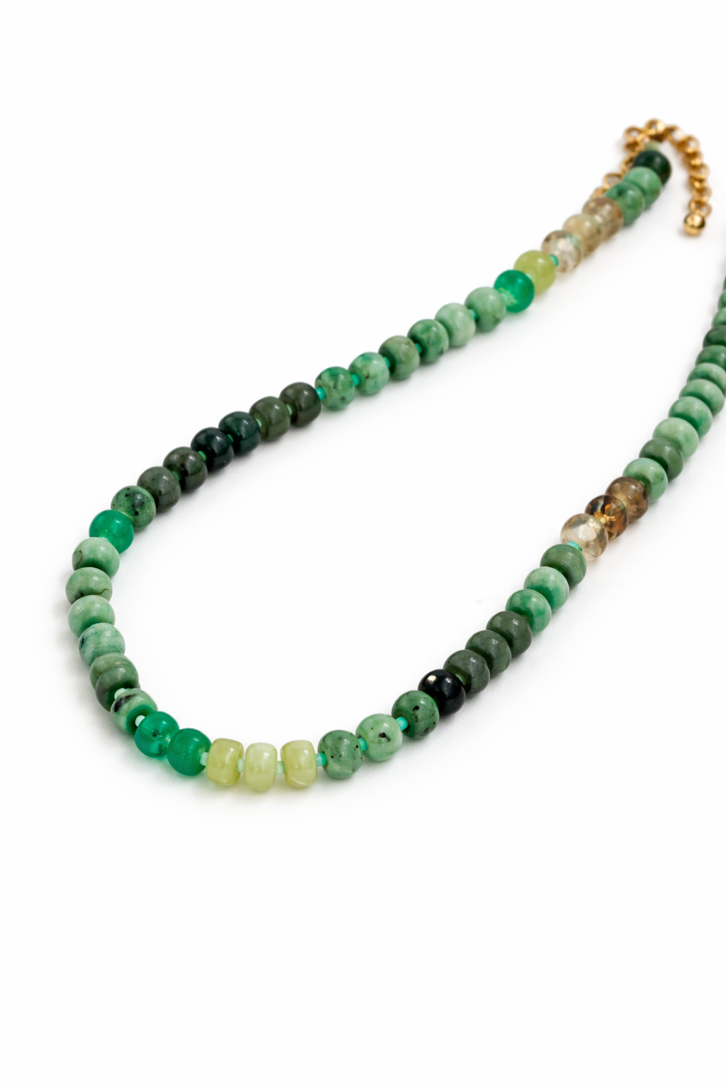 Necklace with green and brown beads on a white background