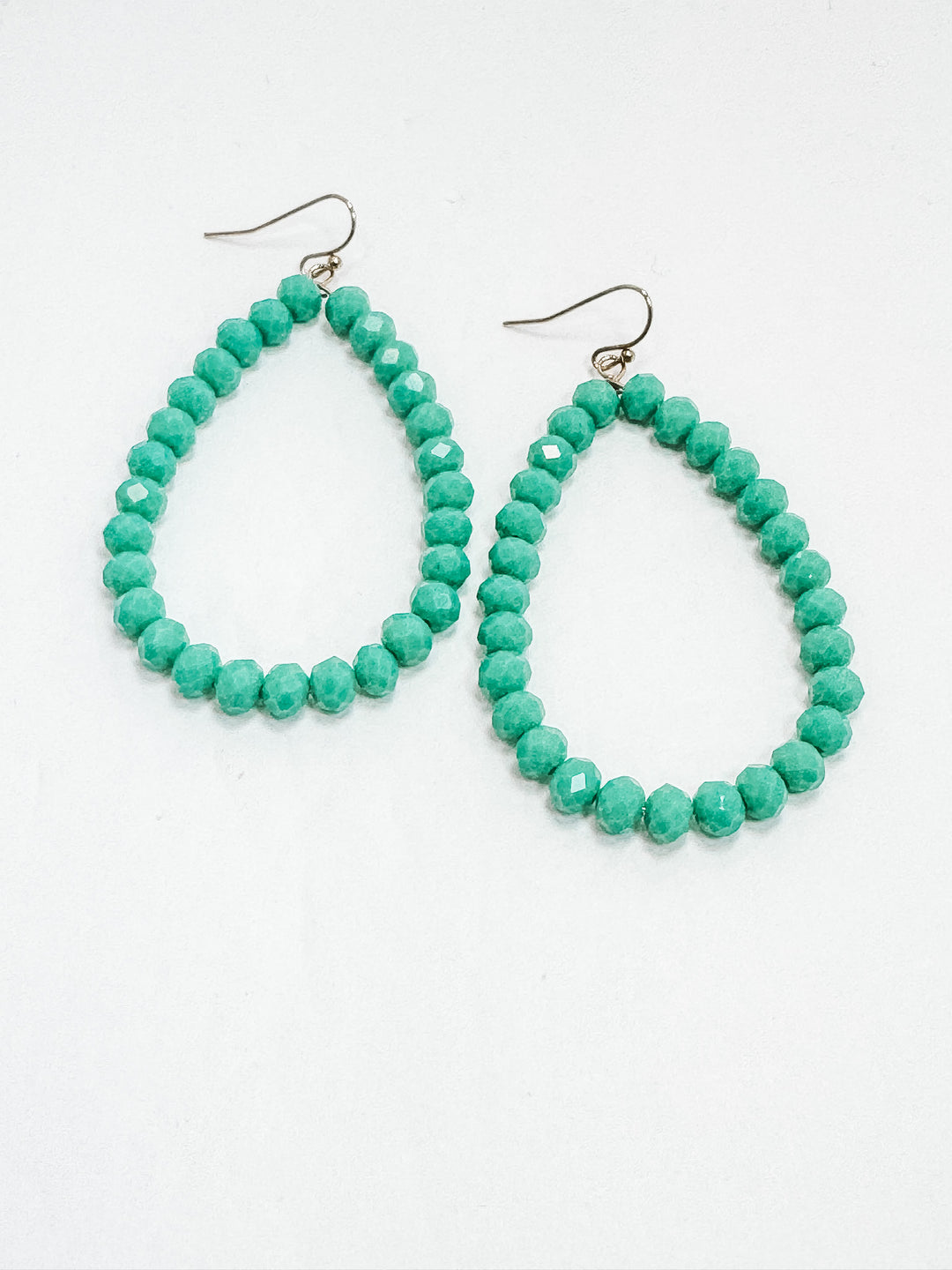 Jade beaded earrings on a white background