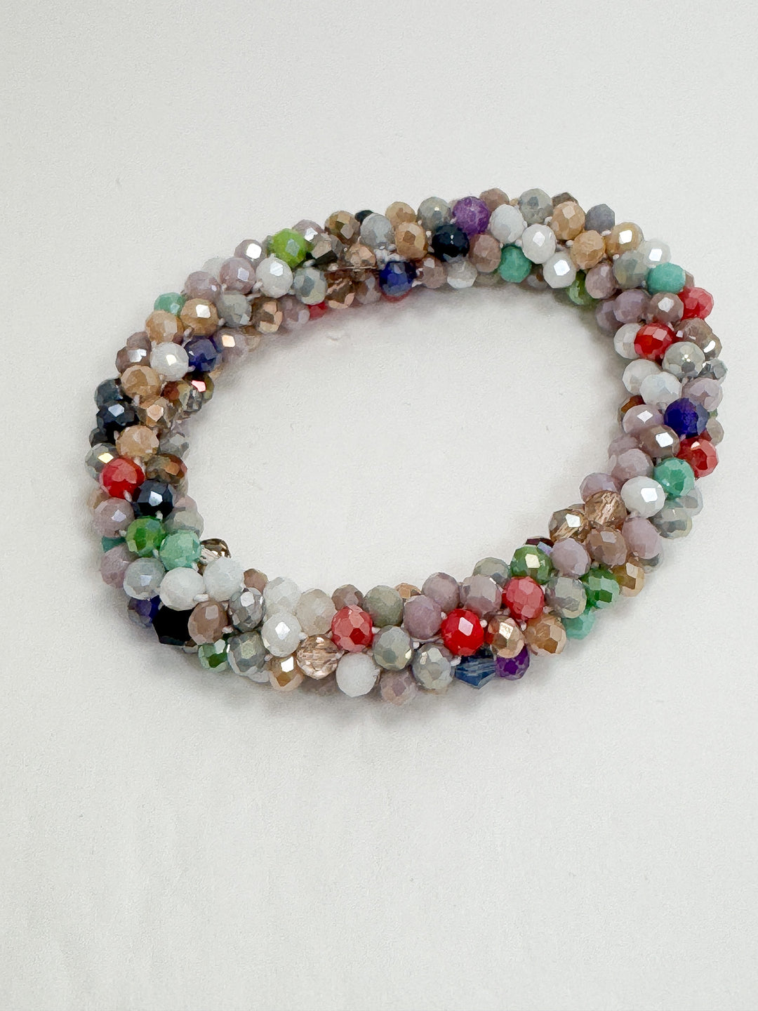 Multicolored beaded bracelet on a white background