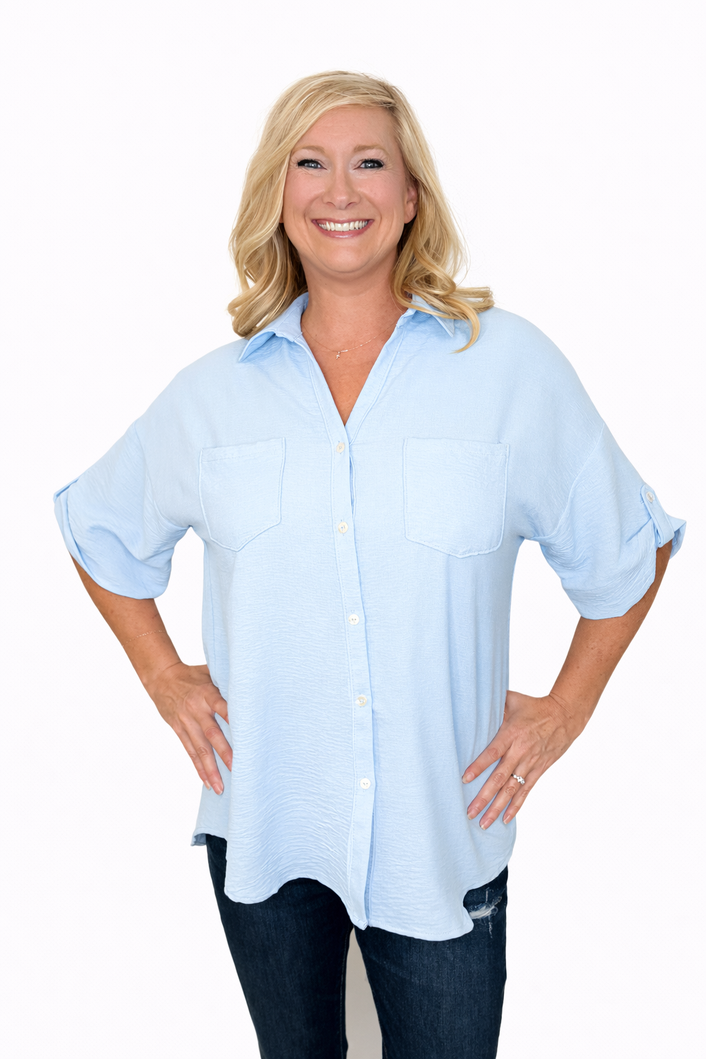 Woman wearing a light blue shirt on a white background