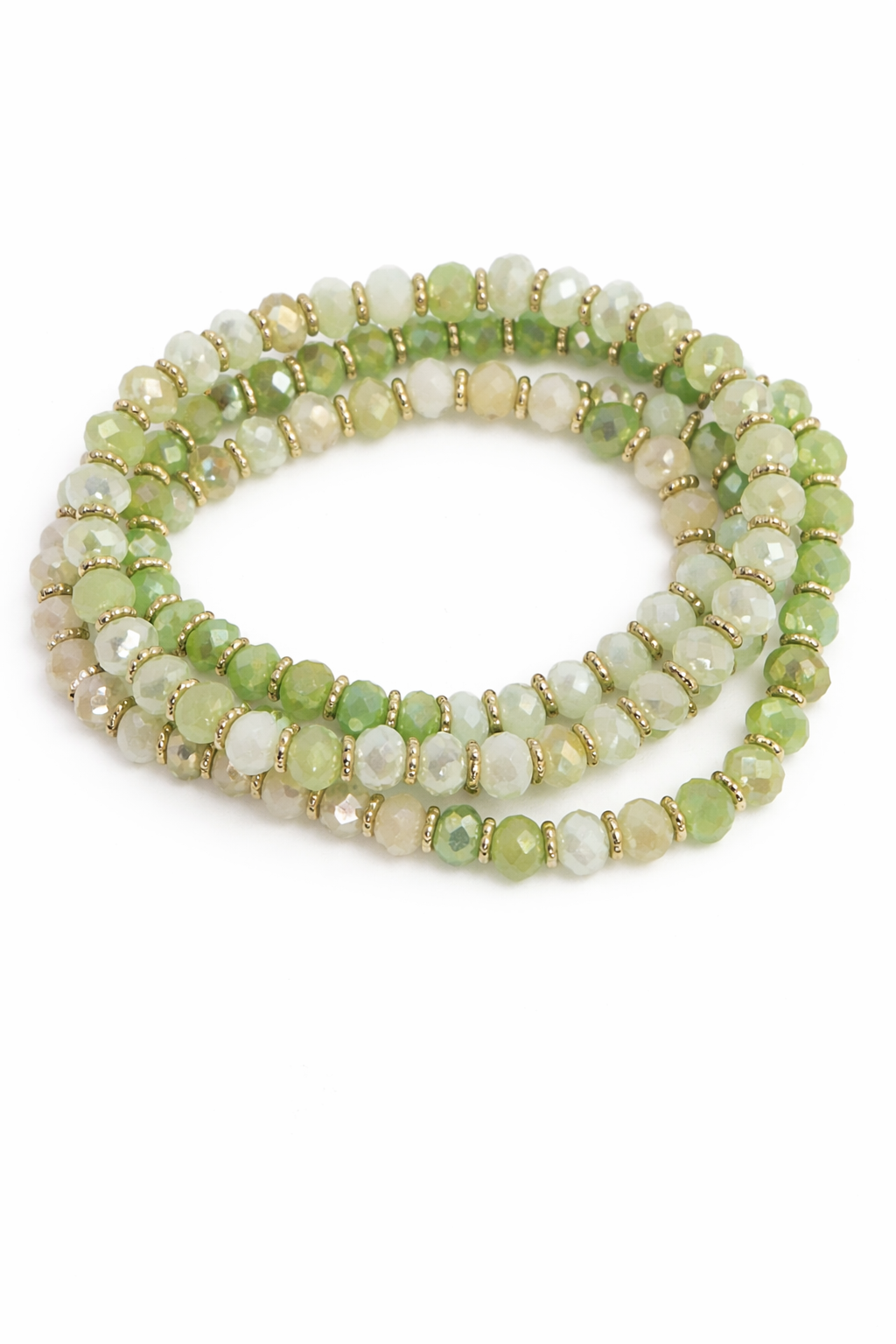 Set of green and white beaded bracelets on a white background