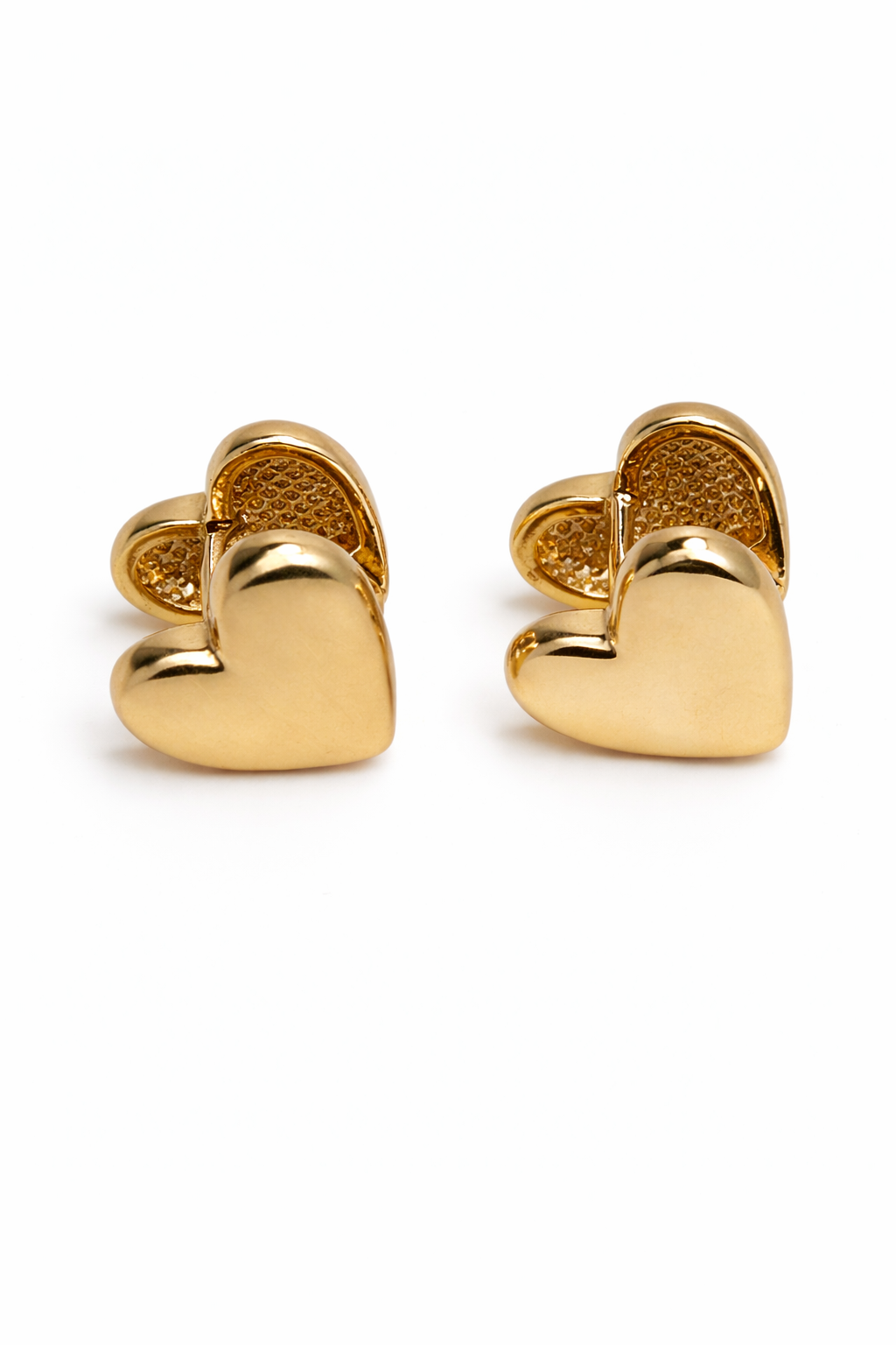 Gold heart-shaped earrings on a white background