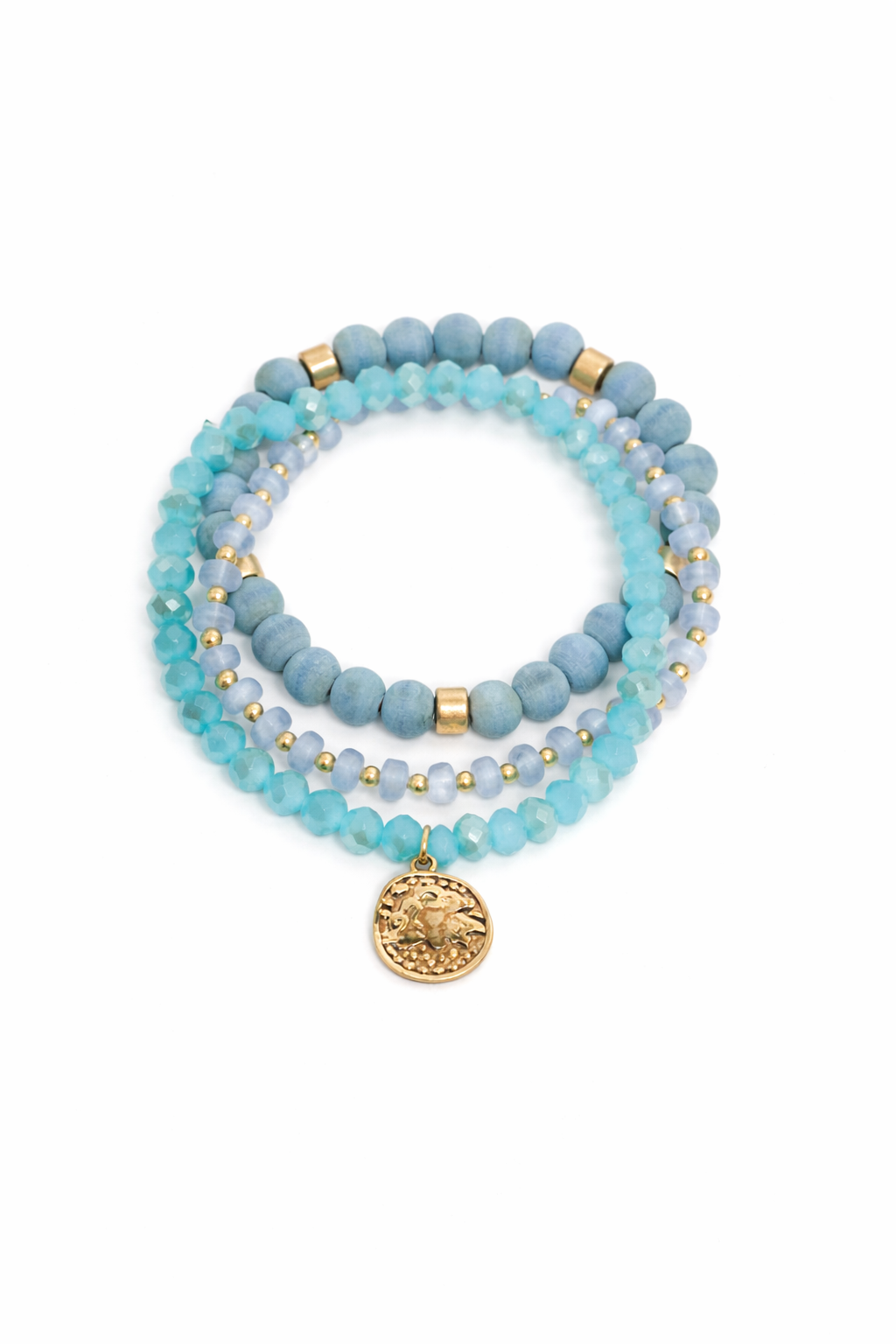 Set of blue beaded bracelets with gold accents on a white background