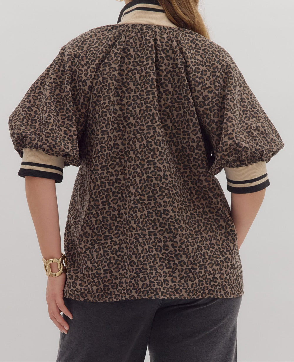 back view of model wearing mocha leopard print top with striped details