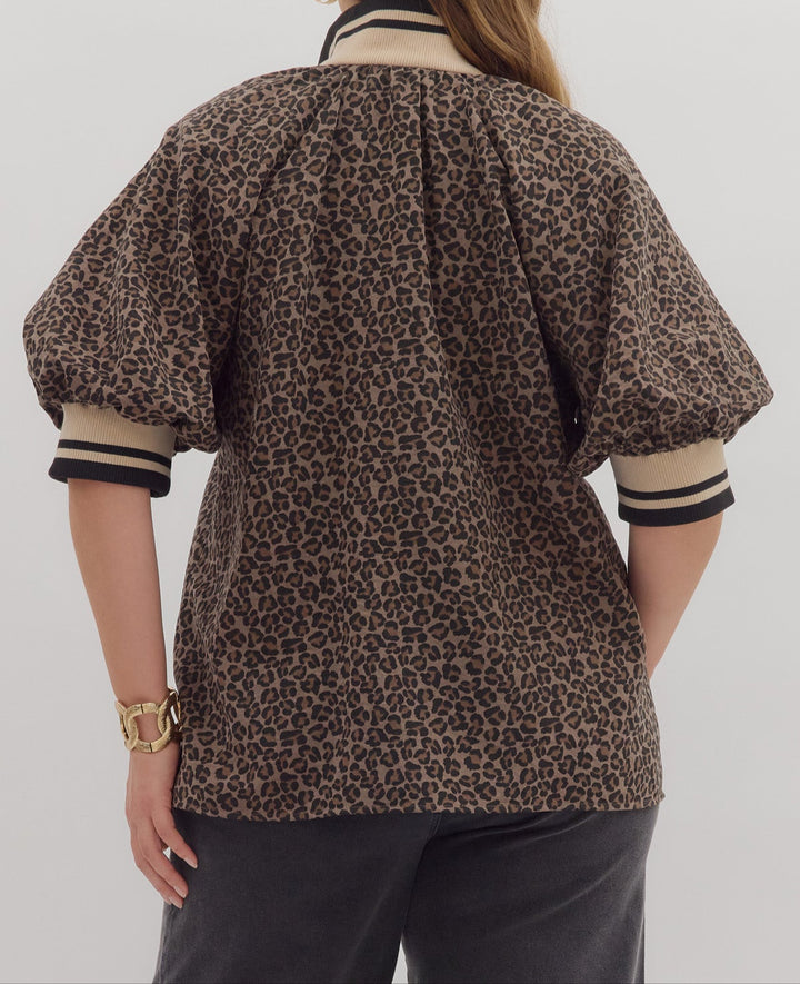 back view of model wearing mocha leopard print top with striped details
