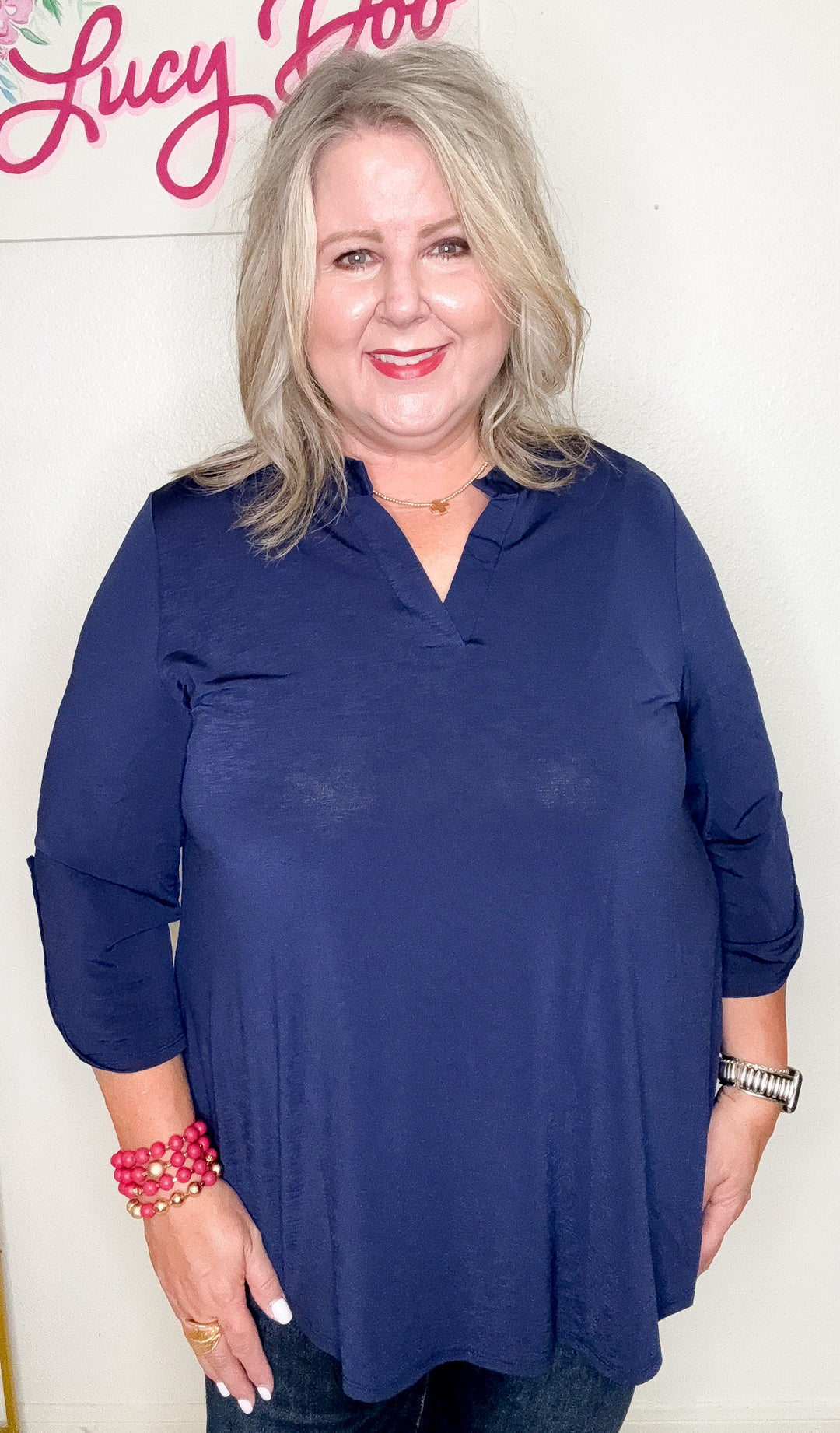 Woman wearing a blue shirt with a white background