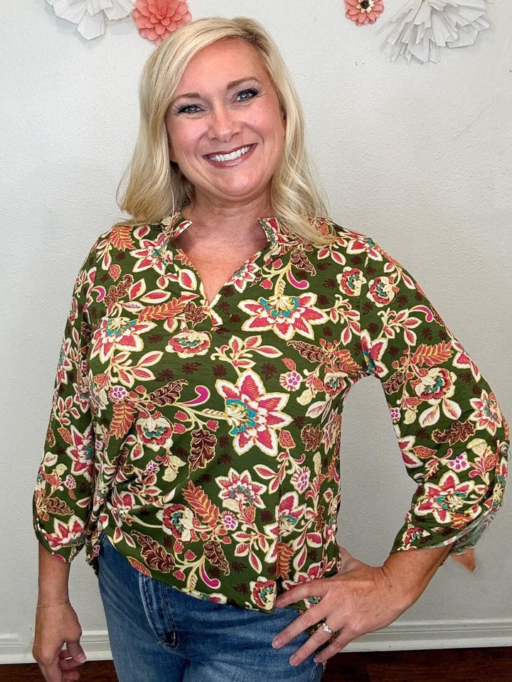 model wearing olive floral top