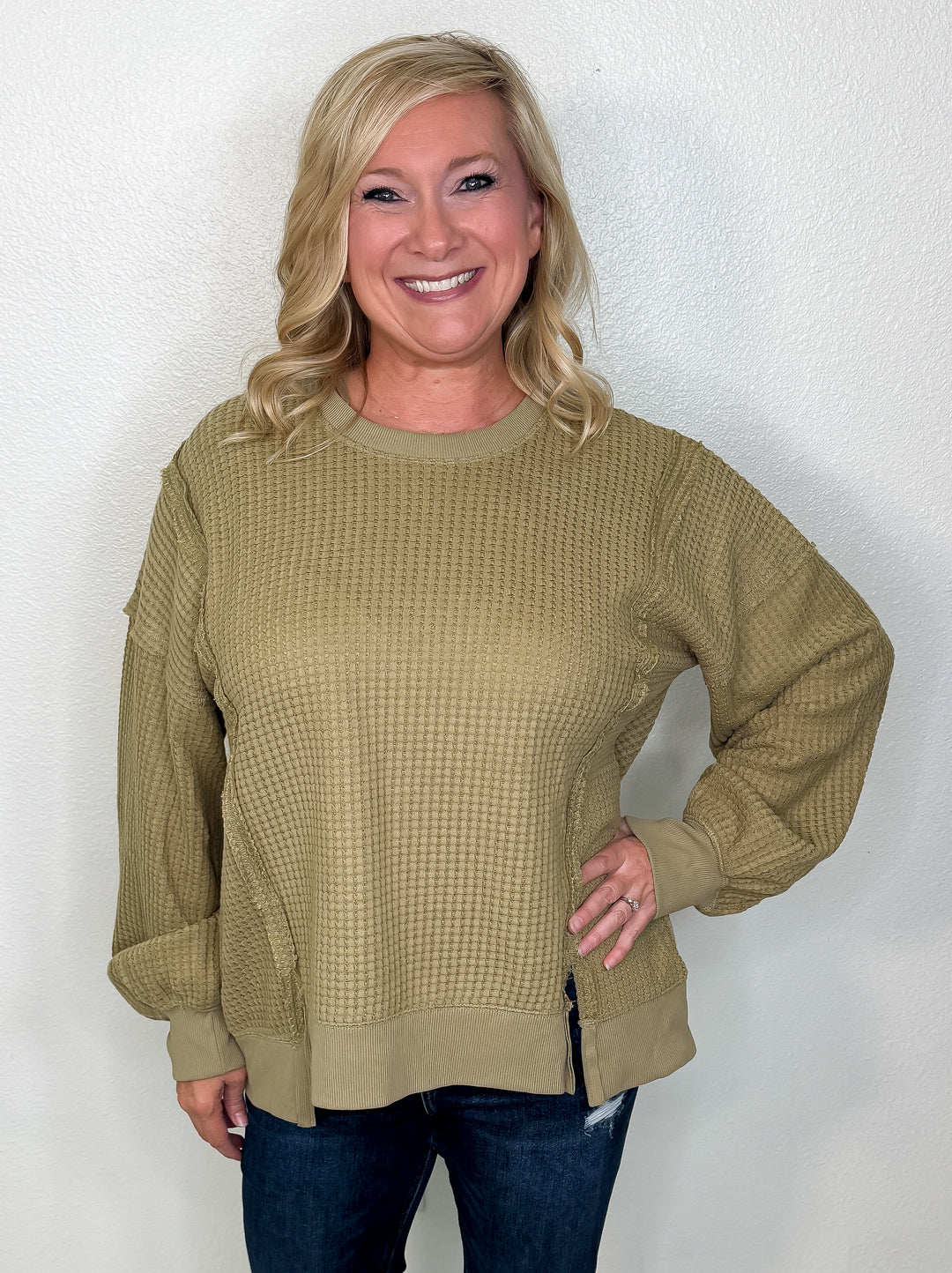 model wearing an olive green waffle knit long sleeve top 