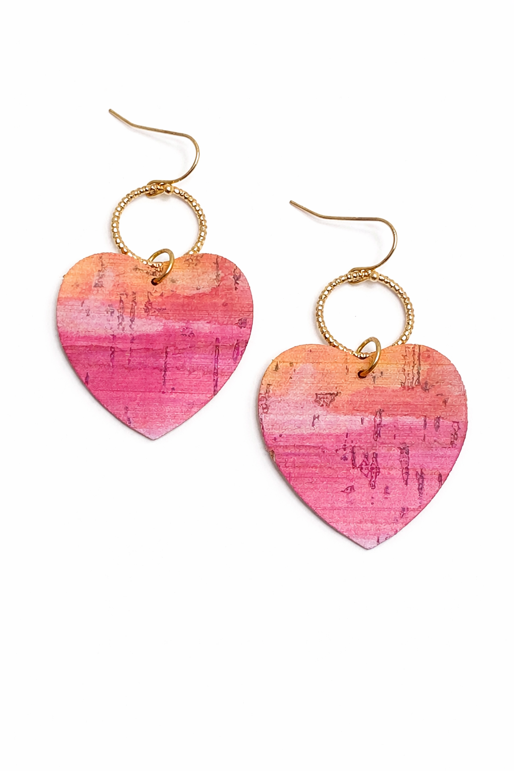 Heart-shaped earrings with pink and orange gradient on a white background