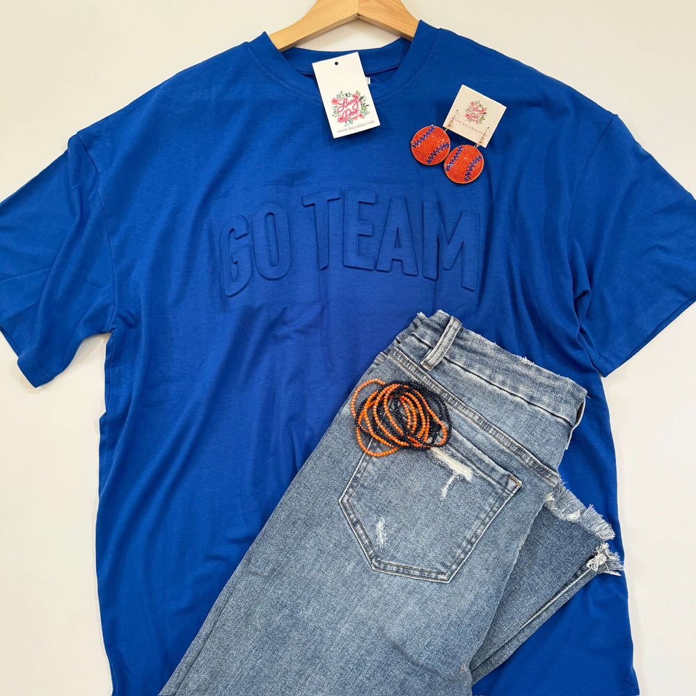 royal blue tee with GO TEAM embossed on front with denim bracelets and earrings