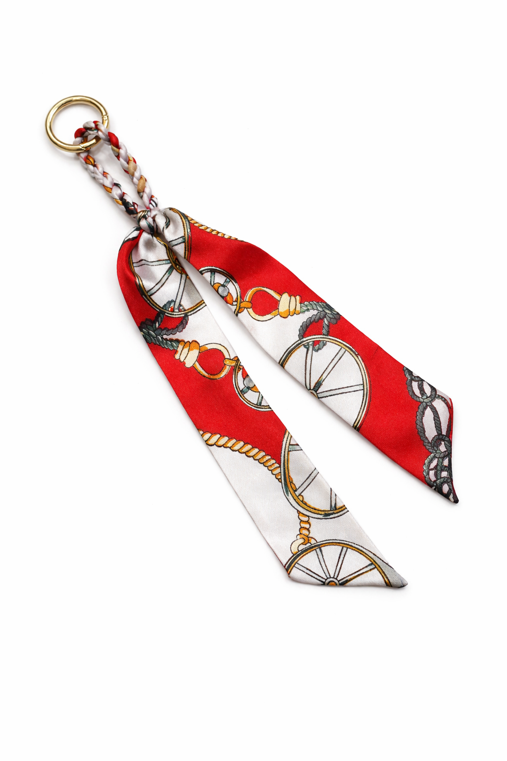 Decorative keychain with red and white pattern on a white background