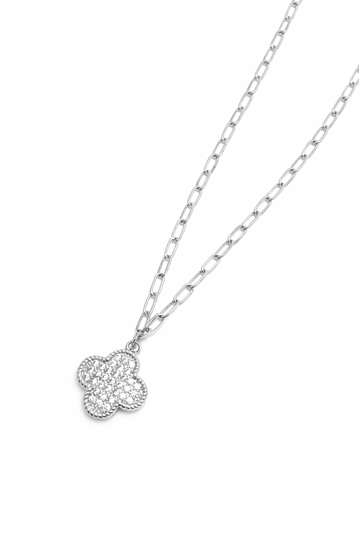 Silver necklace with a heart-shaped pendant on a white background