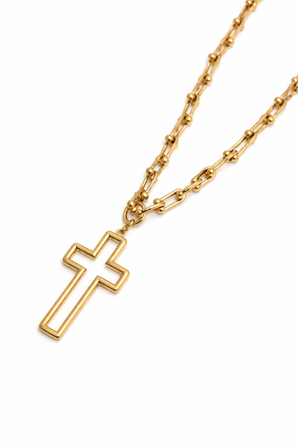 Gold necklace with a cross pendant on a white background