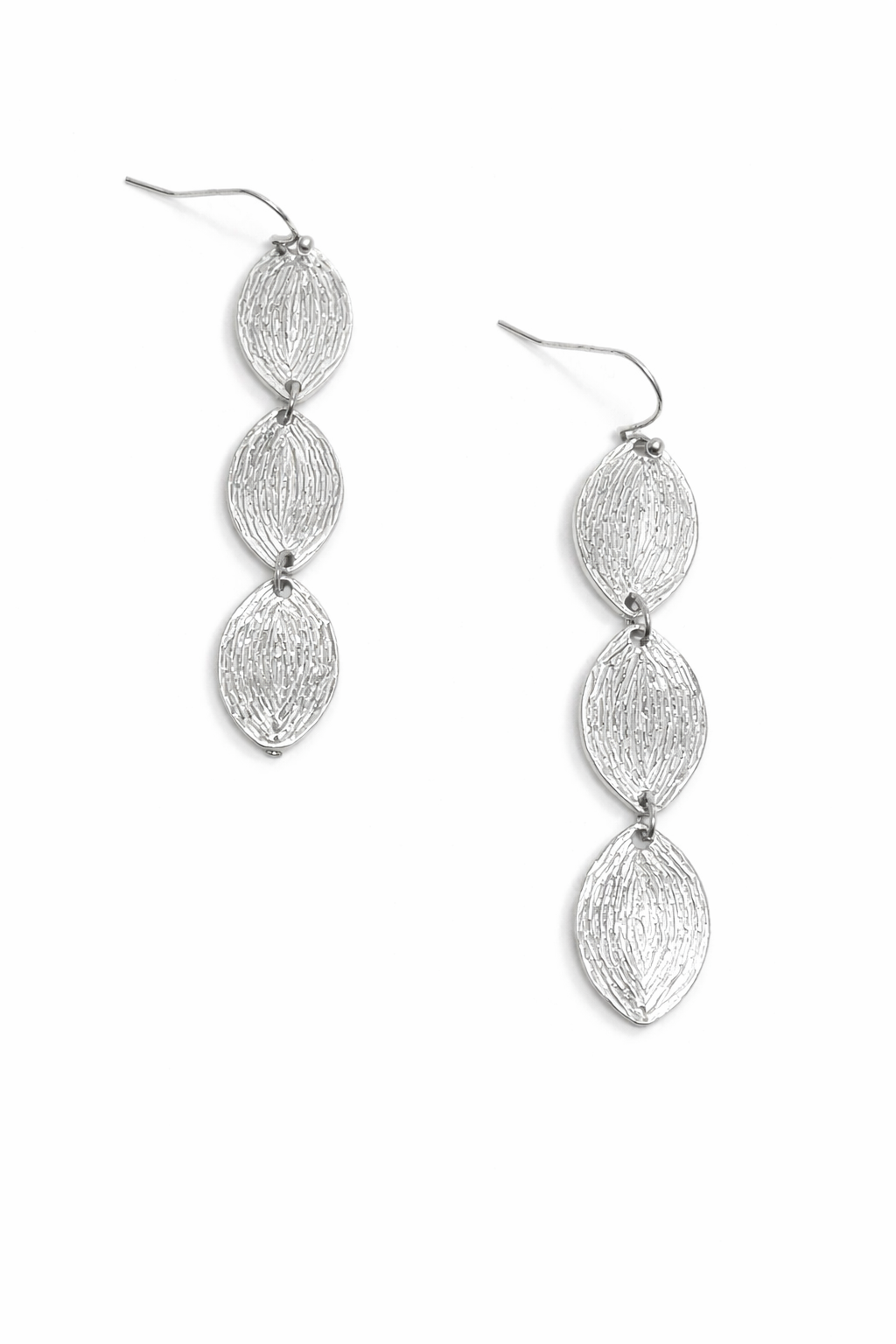 Silver earrings with a textured design on a white background