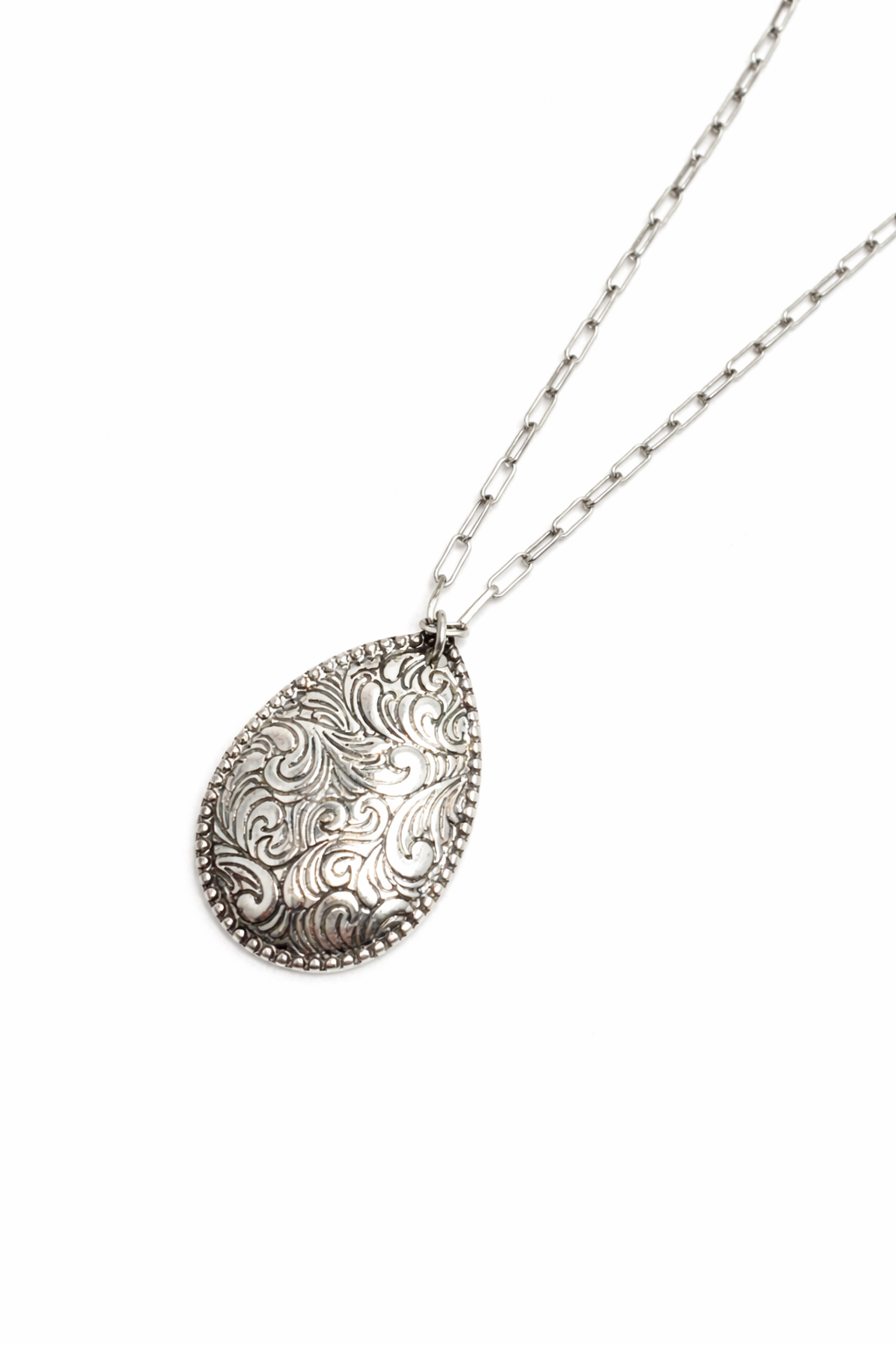 Silver teardrop pendant necklace on a white background